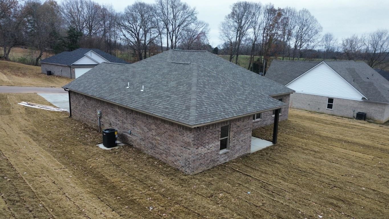 103 Stone Brook Cove Ripley, TN 38063 - Photo 6 of 8 a roof view covered with wooden fence
