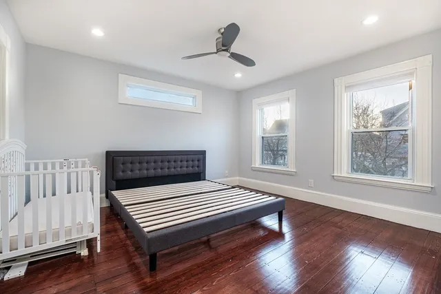 a bedroom with furniture and window