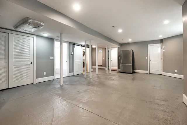 a bathroom with a granite countertop sink a mirror and vanity