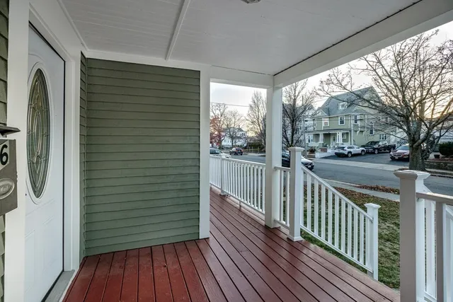 a view of a street with a cars park side of road