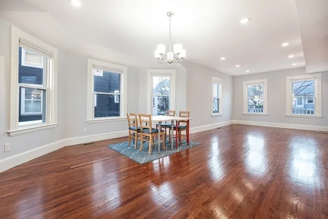 a view of a room with furniture window and wooden floor