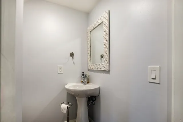 a bathroom with a sink and mirror