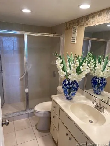 a bathroom with a toilet sink and shower