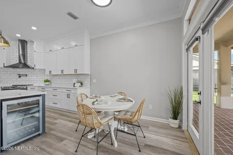 a living room with furniture a rug and a chandelier