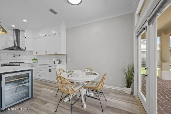 a living room with furniture a rug and a chandelier