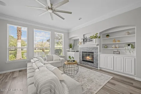 a bath tub sitting in a bathroom next to a window