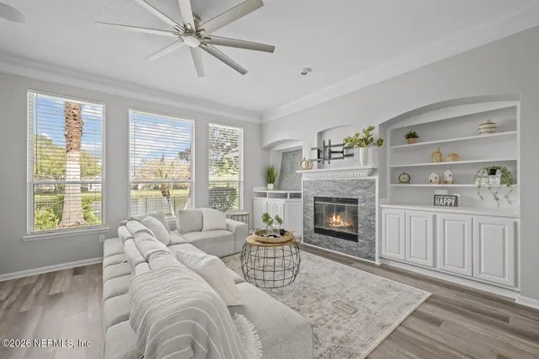 a bath tub sitting in a bathroom next to a window