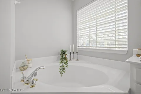 a view of a house with backyard and porch