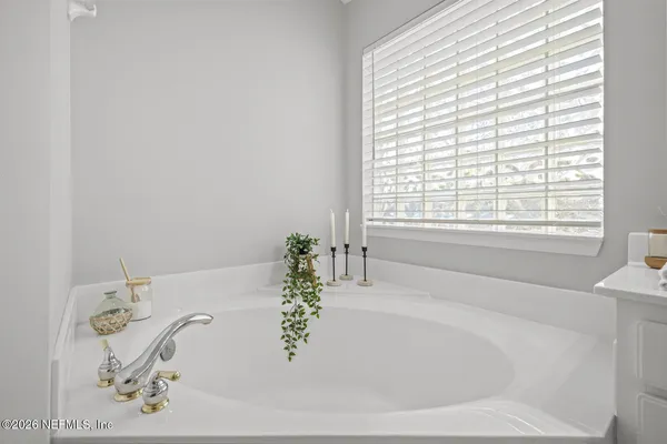 a view of a house with backyard and porch