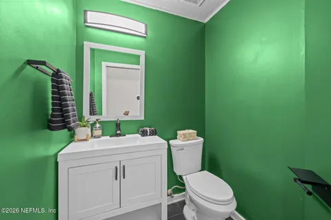 an aerial view of a house with a lake view