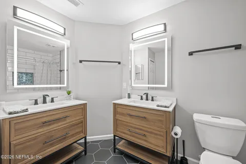 an aerial view of a house with a swimming pool