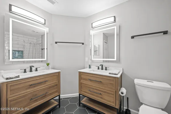 an aerial view of a house with a swimming pool