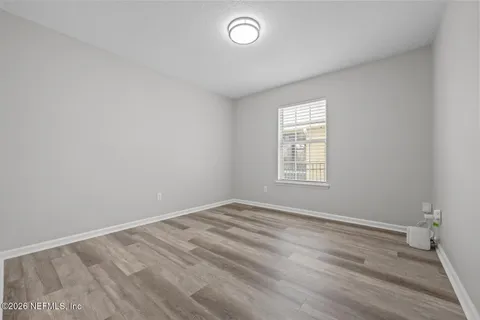 an aerial view of a house with swimming pool and outdoor seating