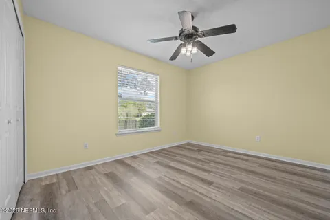 an aerial view of a house with a swimming pool yard and lake view