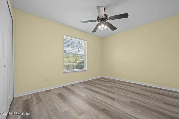 an aerial view of a house with a swimming pool yard and lake view