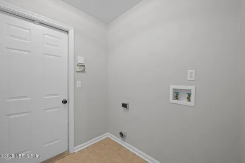 aerial view of a house with swimming pool and outdoor seating