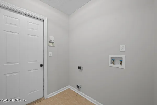 aerial view of a house with swimming pool and outdoor seating