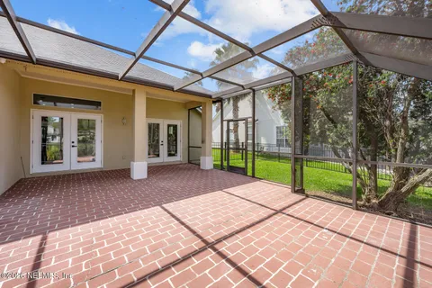an aerial view of a house with a swimming pool yard and outdoor seating