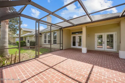 a view of a swimming pool with a yard