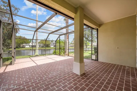 a view of a swimming pool with a table and chairs