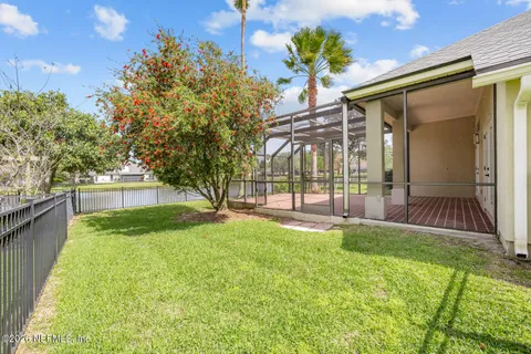 an aerial view of a house with outdoor space