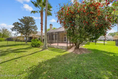 an aerial view of a house with swimming pool patio and outdoor seating