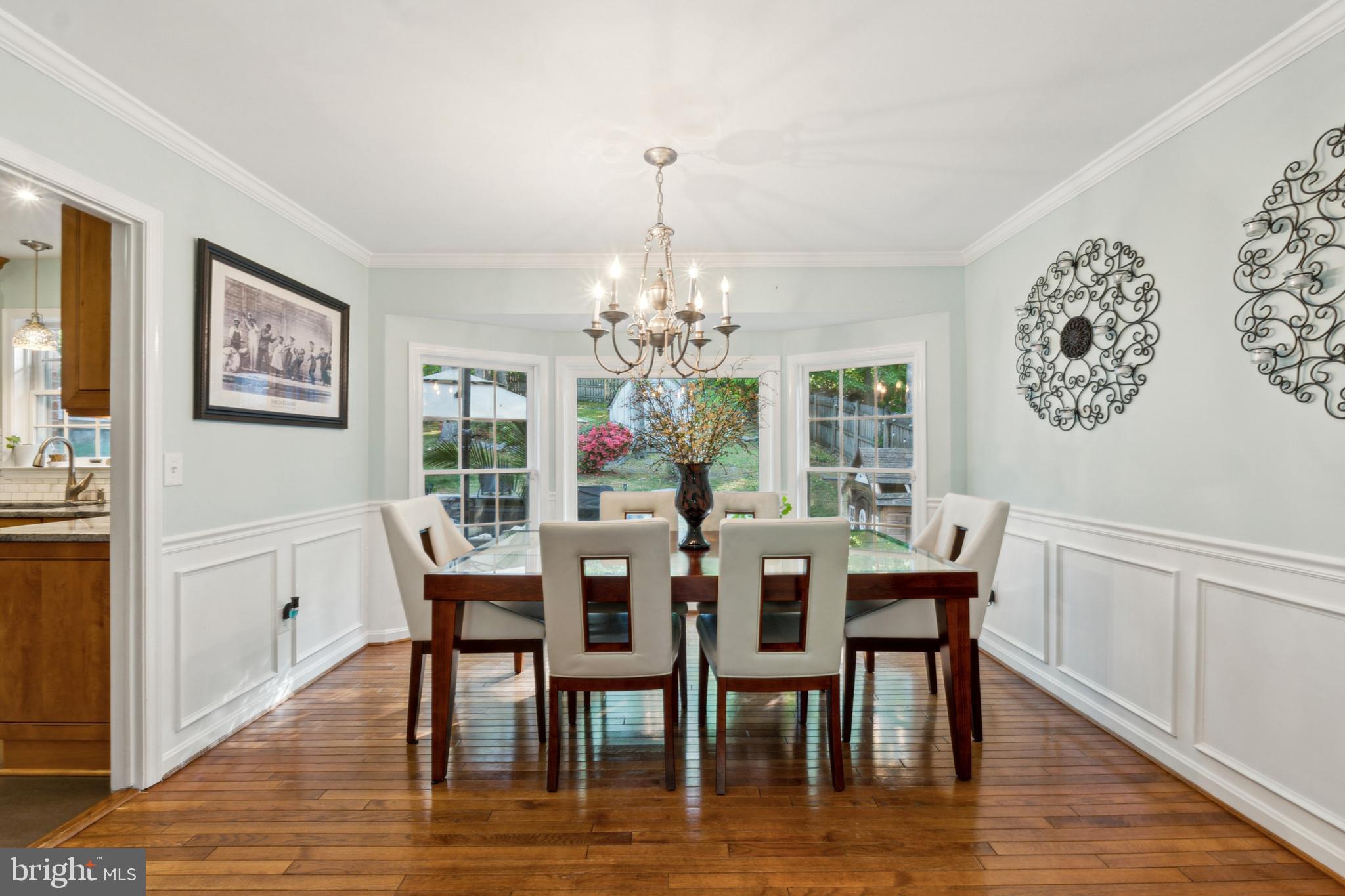 18600 Cabin Road Triangle, VA 22172 - Photo 15 of 39 a view of a dining room with furniture wooden floor and a chandelier