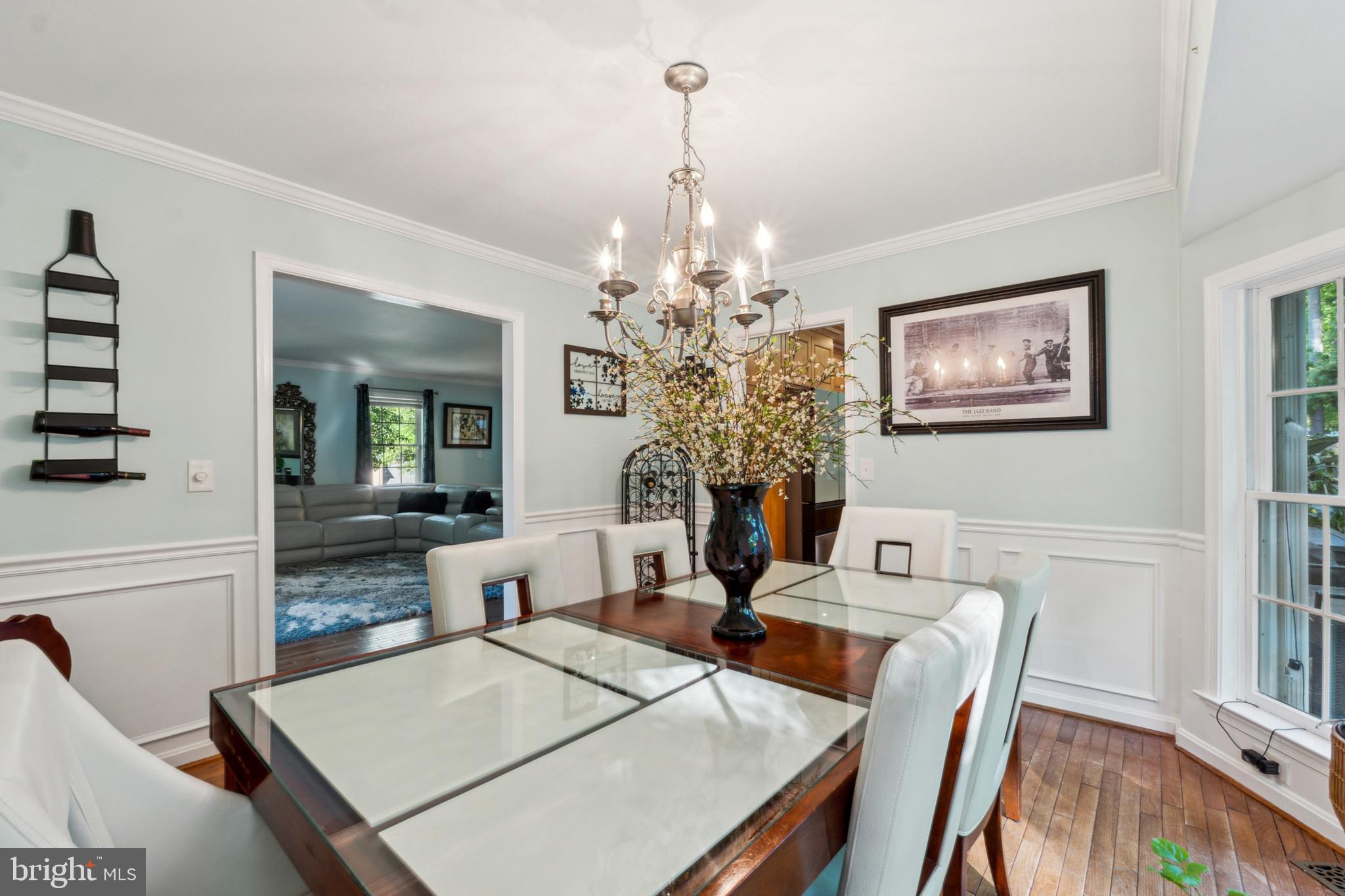 18600 Cabin Road Triangle, VA 22172 - Photo 16 of 39 a view of a dining room with furniture and chandelier