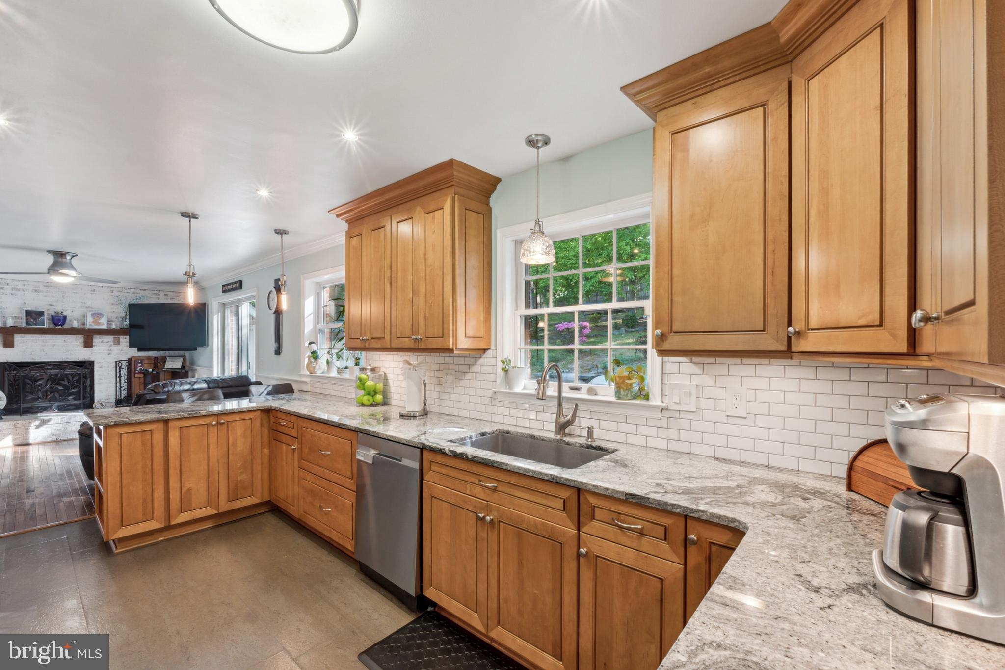 18600 Cabin Road Triangle, VA 22172 - Photo 17 of 39 a kitchen with granite countertop a sink and a stove top oven