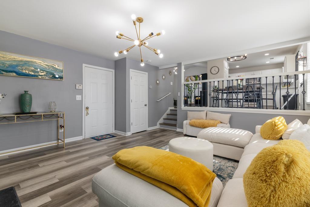 5914 Waggoner Court Rex, GA 30273 - Photo 13 of 23 a bedroom with a bed couch chandelier and a window