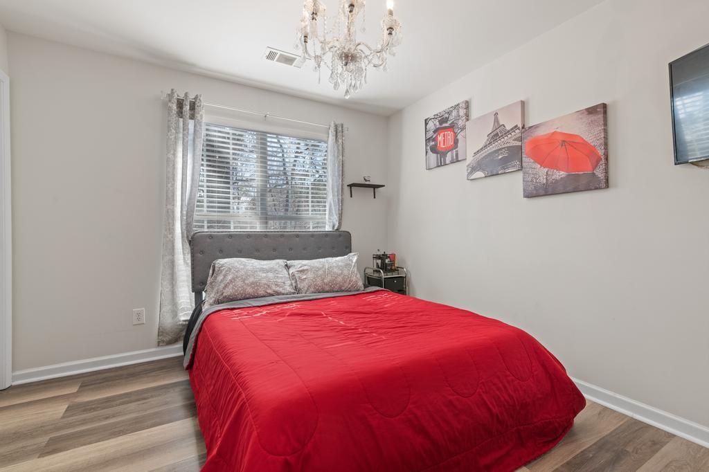 5914 Waggoner Court Rex, GA 30273 - Photo 22 of 23 a bed sitting in a bedroom next to a window