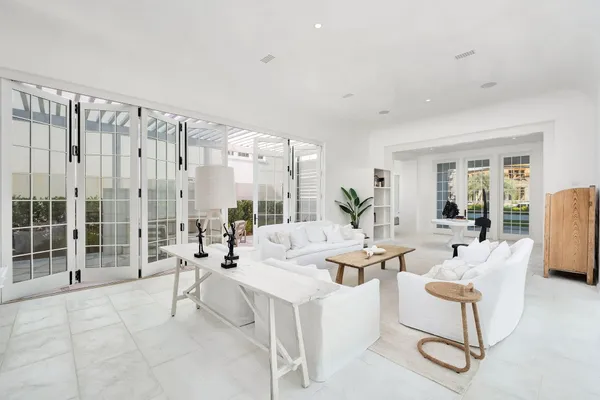 a living room with furniture and a lamp