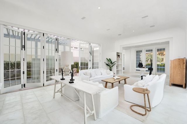 a living room with furniture and a lamp