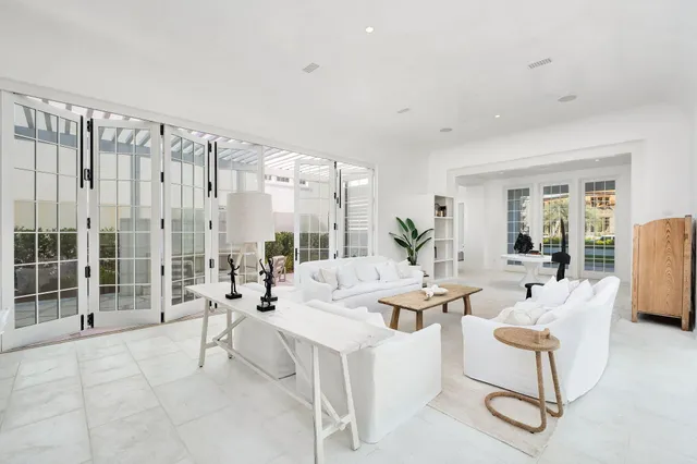 a living room with furniture and a lamp