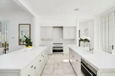 a living room with furniture and a large mirror