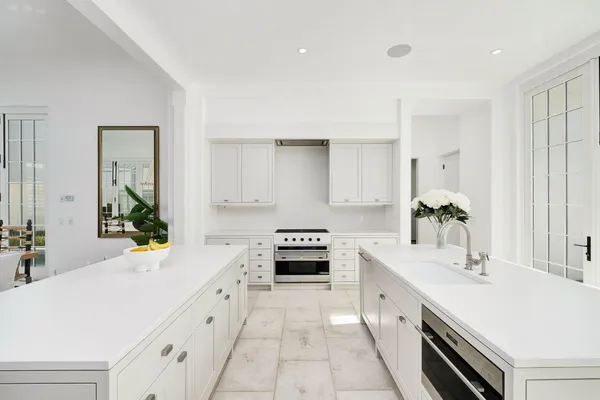 a living room with furniture and a large mirror
