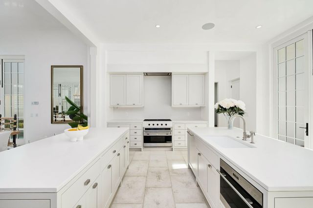 a living room with furniture and a large mirror