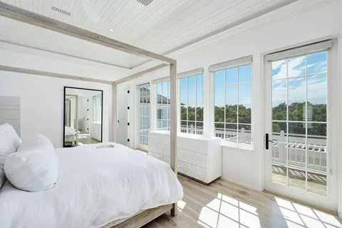 a view of an entryway with wooden floor and windows