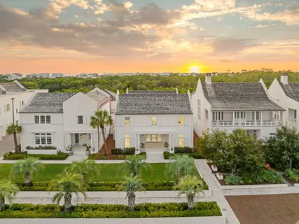 a view of swimming pool of a house with outdoor seating