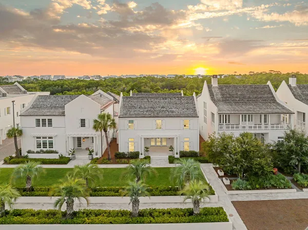 a view of swimming pool of a house with outdoor seating