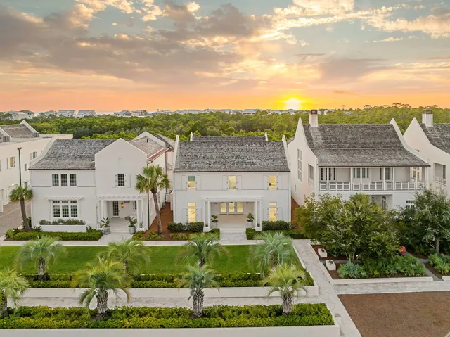 a view of swimming pool of a house with outdoor seating