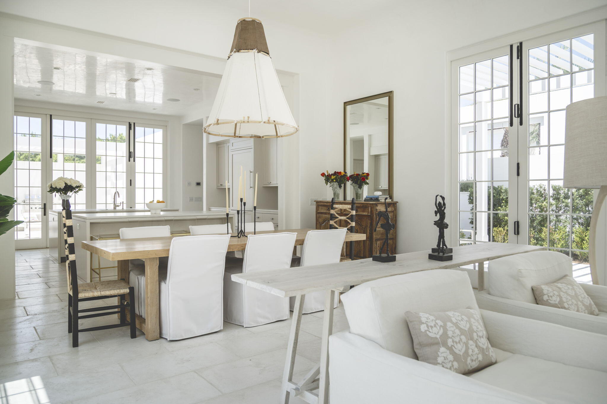 109 Kaiya Avenue Inlet Beach, FL 32461 - Photo 6 of 30 a living room with furniture a large window and a chandelier