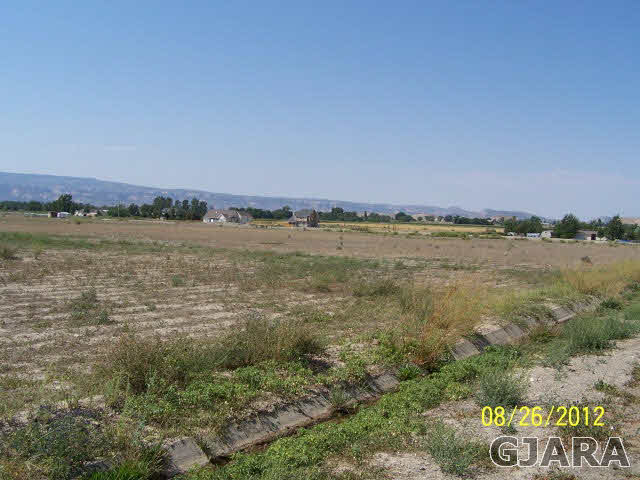 1825 O Road Fruita, CO 81521 - Photo 6 of 11 a view of a lake and a city