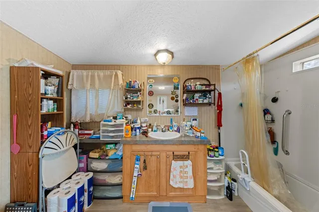 a bedroom that has a bed and a tv in it