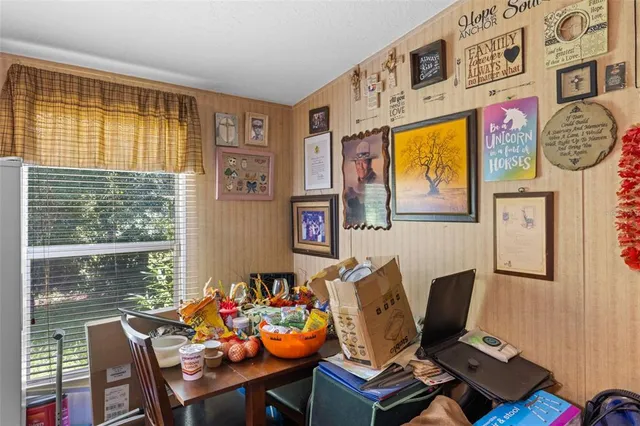 a workspace with furniture and window