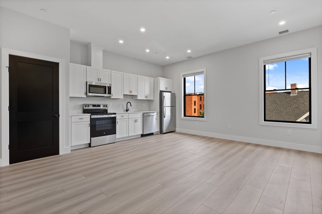198 Albion Street, Unit 202 Wakefield, MA 01880 - Photo 1 of 13 a view of kitchen with sink and refrigerator