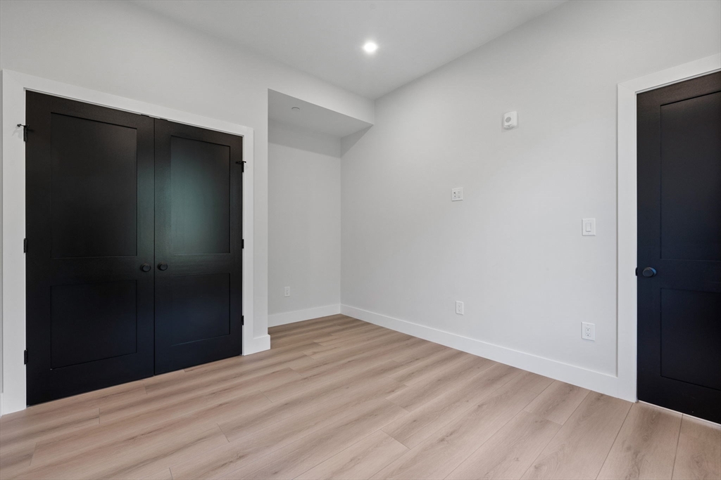 198 Albion Street, Unit 202 Wakefield, MA 01880 - Photo 5 of 13 a view of hallway with wooden floor