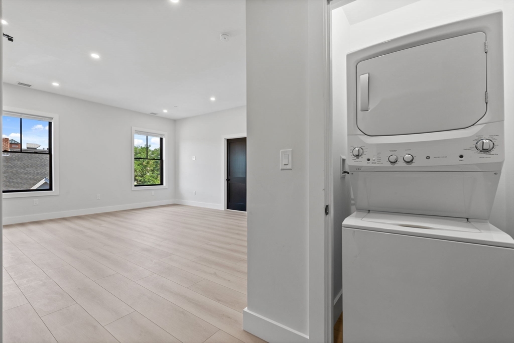 198 Albion Street, Unit 202 Wakefield, MA 01880 - Photo 8 of 13 a view of a room with wooden floor and mirror