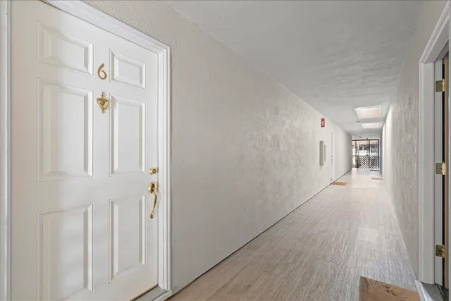 a kitchen with stainless steel appliances granite countertop a sink a stove and cabinets