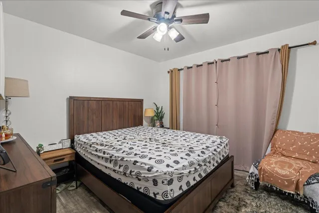 a bedroom with a bed and a dresser